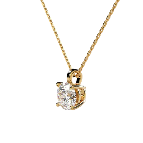 A gold solitaire necklace with a round brilliant-cut diamond pendant, shown on a clean, light beige background.
