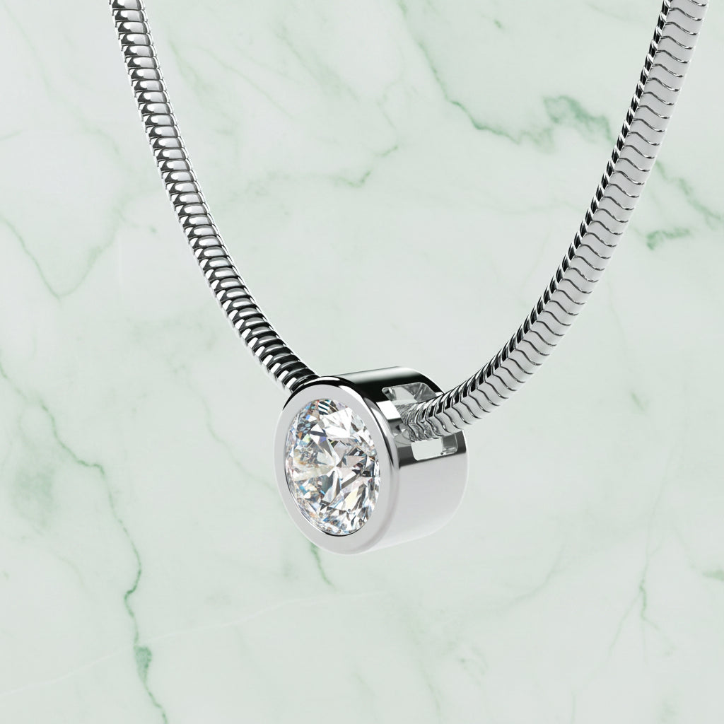 Silver necklace with a round diamond pendant on a light beige background