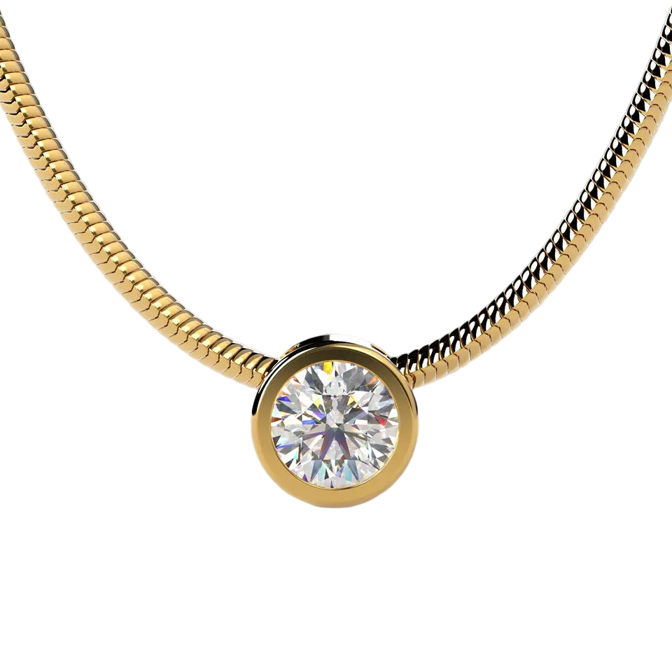 A gold snake chain necklace with a round bezel-set clear gemstone pendant, shown against a light beige background.
