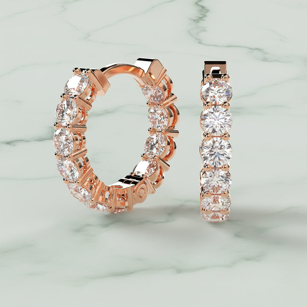 Rose gold hoop earrings with clear gemstones on a beige background