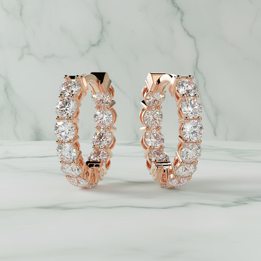 Rose gold hoop earrings with clear gemstones on a light beige background