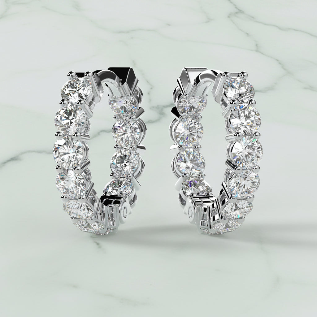Pair of diamond hoop earrings on a light beige background