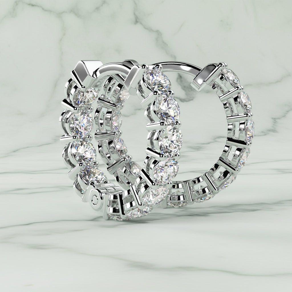 Pair of diamond hoop earrings on a light beige background