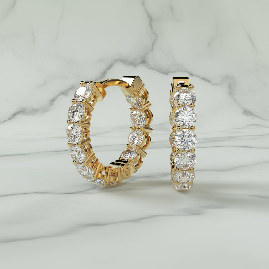 Gold hoop earrings with clear gemstones on a beige background