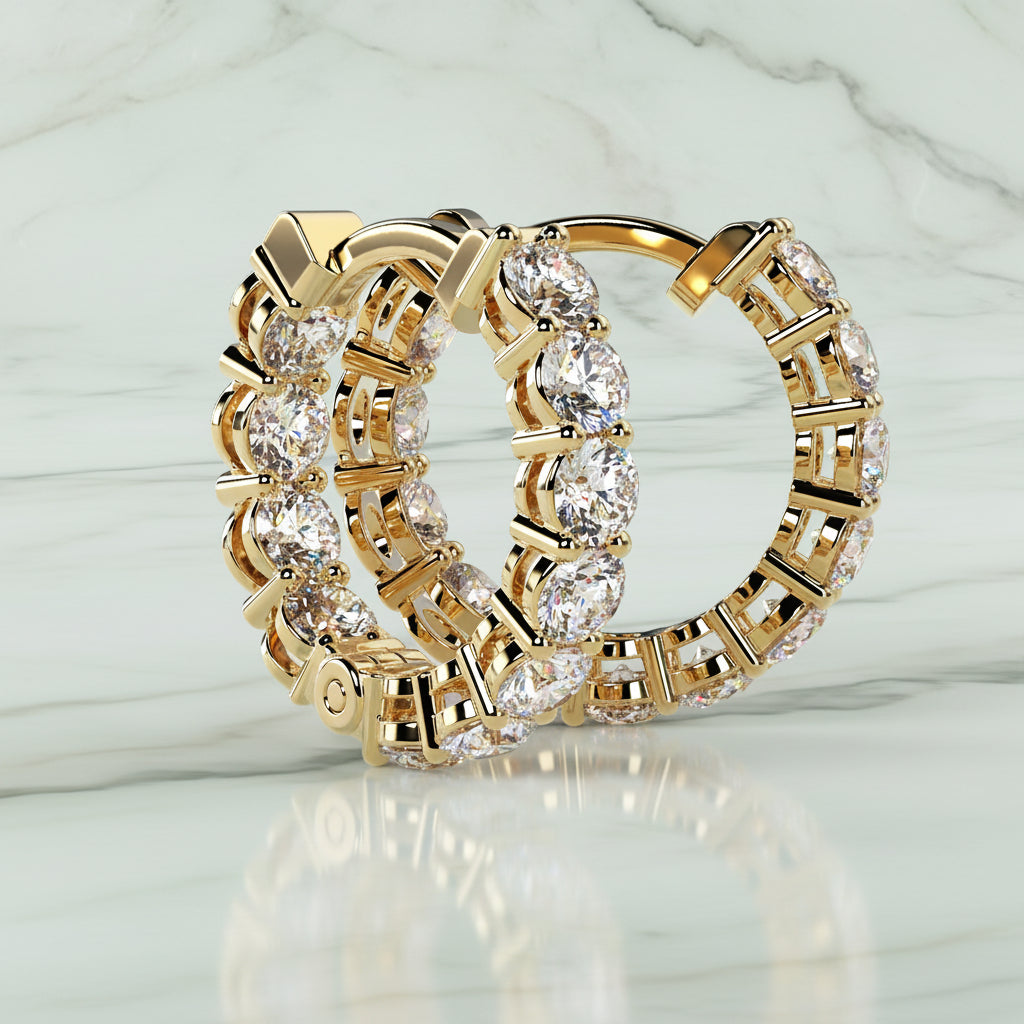 Gold hoop earrings with diamond accents on a light beige background