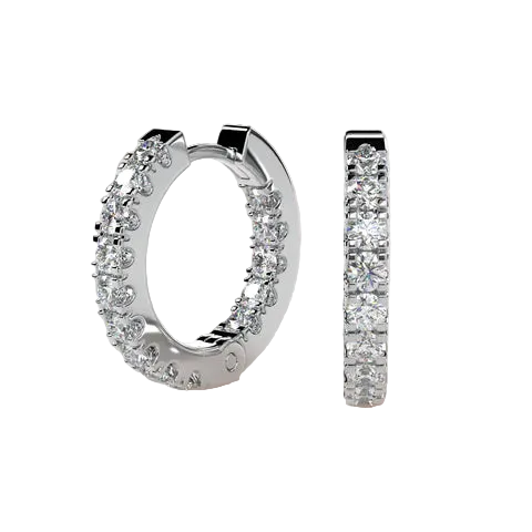 A pair of silver huggie hoop earrings paved with clear round-cut gemstones, shown from two angles against a soft beige background.