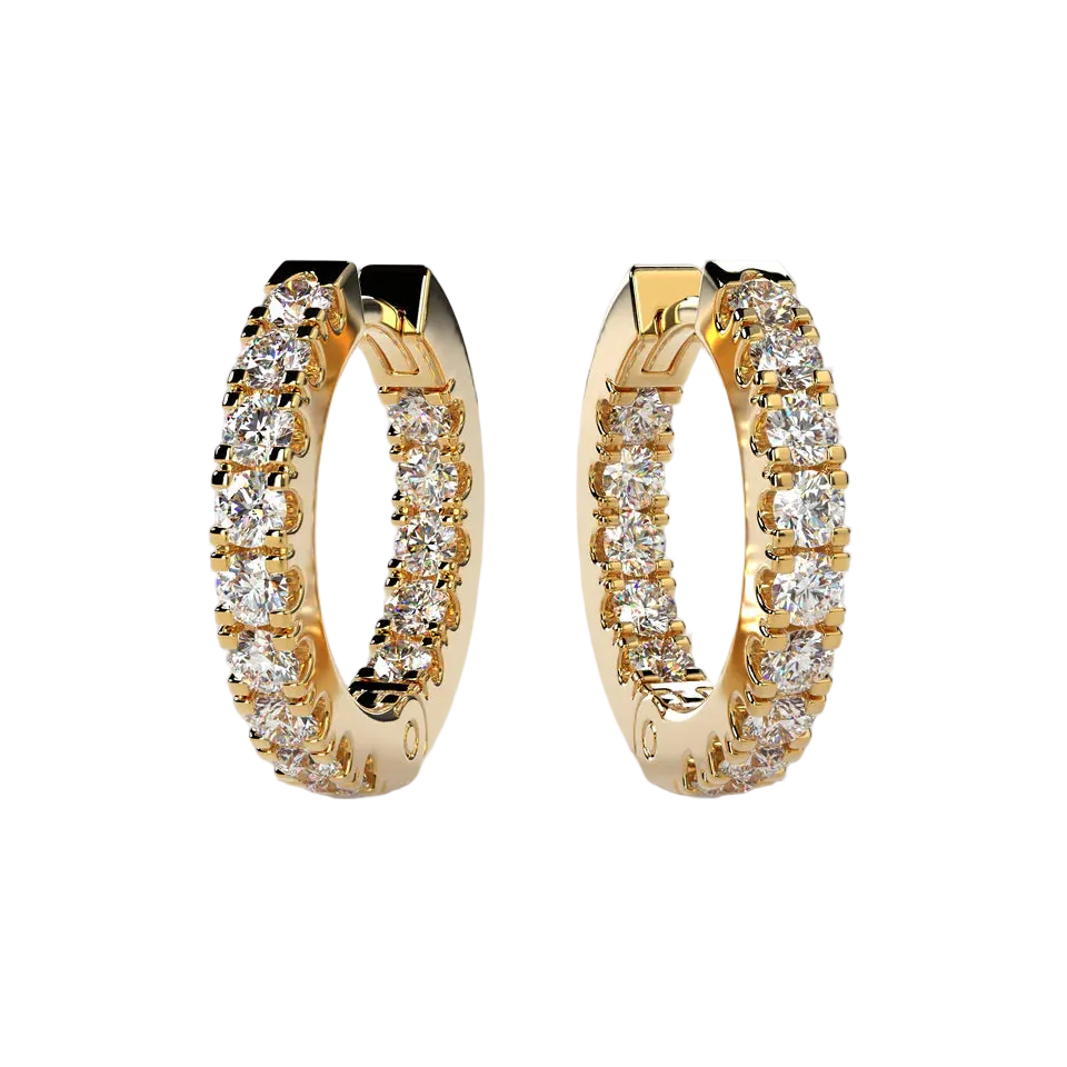 A pair of gold huggie hoop earrings set with round clear gemstones, displayed on a light beige background.
