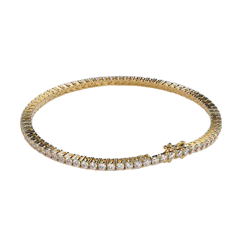 A gold tennis bracelet with a textured pavé setting, featuring clear round-cut stones along the front and a small bow detail on the clasp, set against a solid light beige background.