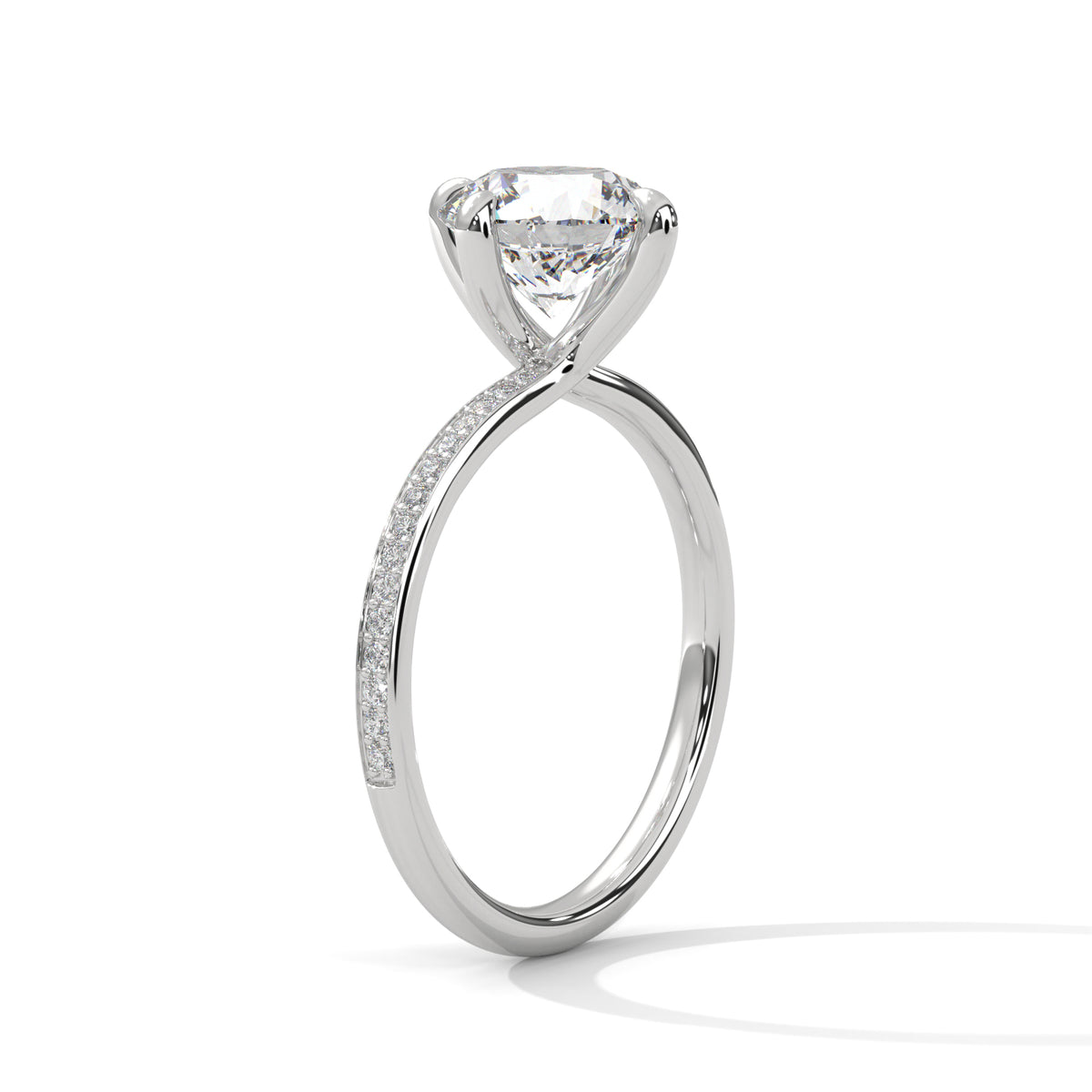 Silver ring with a large diamond and smaller diamonds on the band against a white background