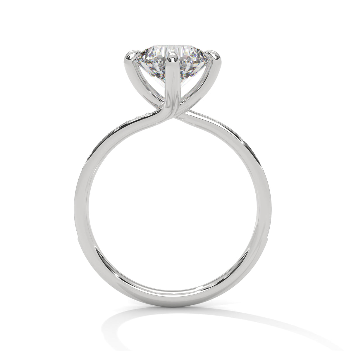 A classic solitaire diamond engagement ring in a polished silver-colored metal, featuring a round-cut diamond set in a four-prong crown on a tapered band, shown against a plain white background with a soft reflection.
