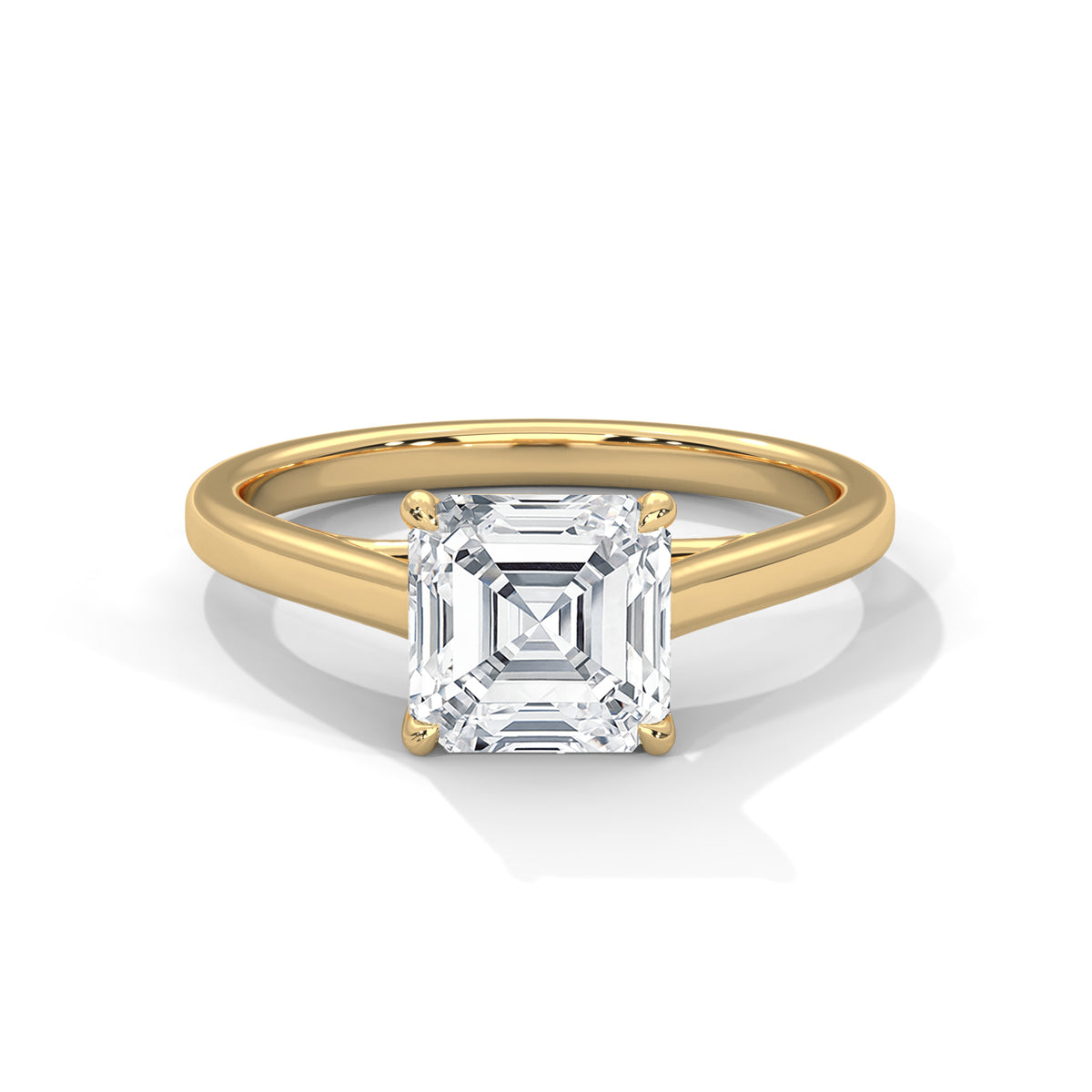 Gold ring with a large diamond on a white background