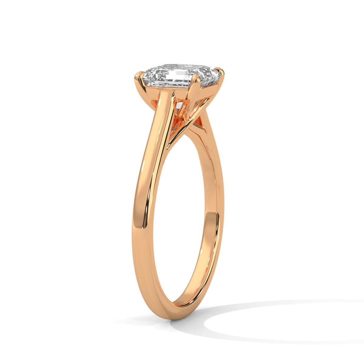 Rose gold ring with a diamond on a white background