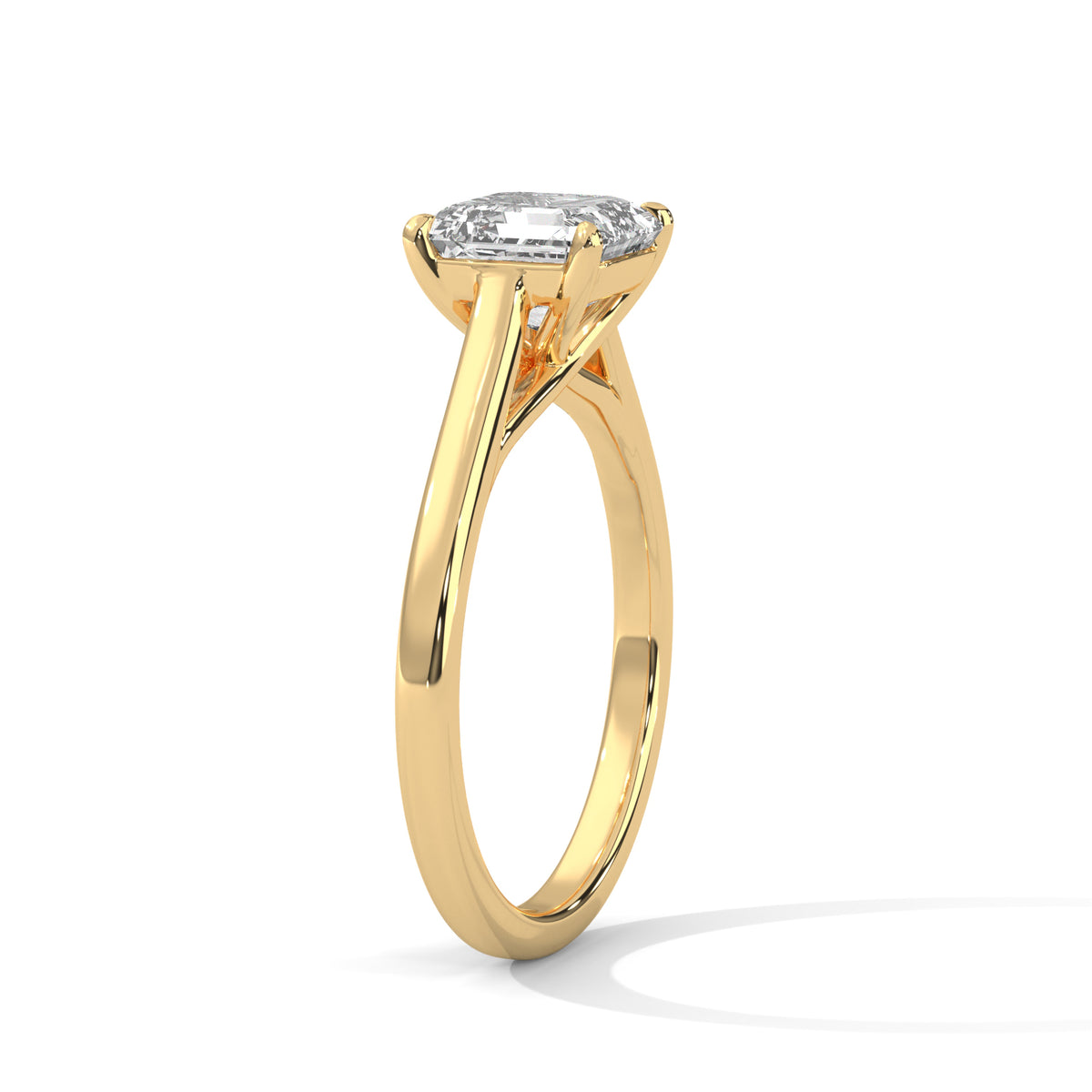 Gold ring with a diamond on a white background