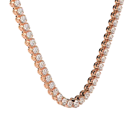 A close-up of a rose gold tennis necklace with round-cut clear gemstones, arranged in a U-shape against a solid light beige background.