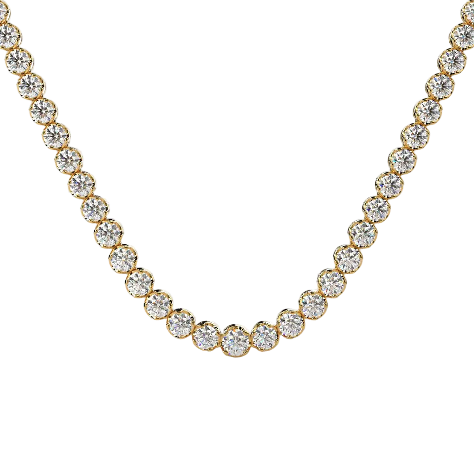 A gold tennis necklace featuring round-cut clear gemstones in a classic prong setting, displayed against a solid pale beige background.