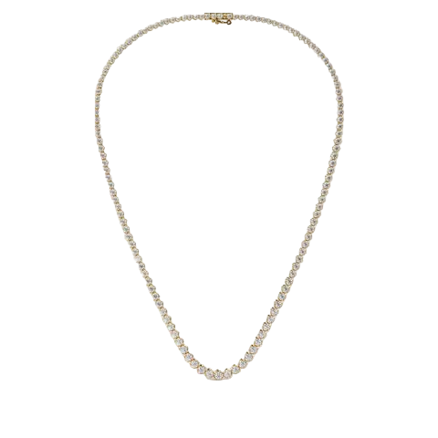 A delicate tennis-style necklace with small clear stones set in a silver-toned metal, displayed on a solid light beige background.