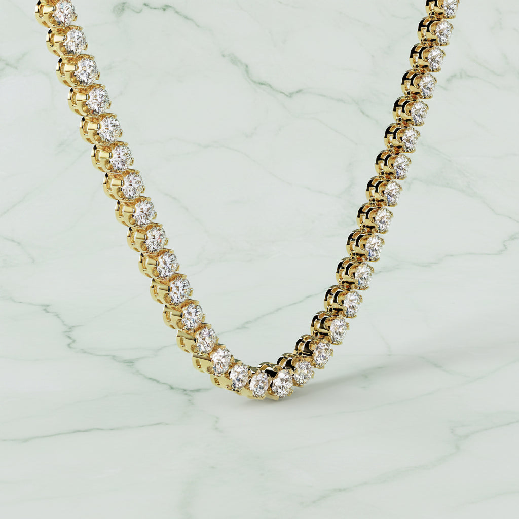 Gold and diamond necklace on a beige background