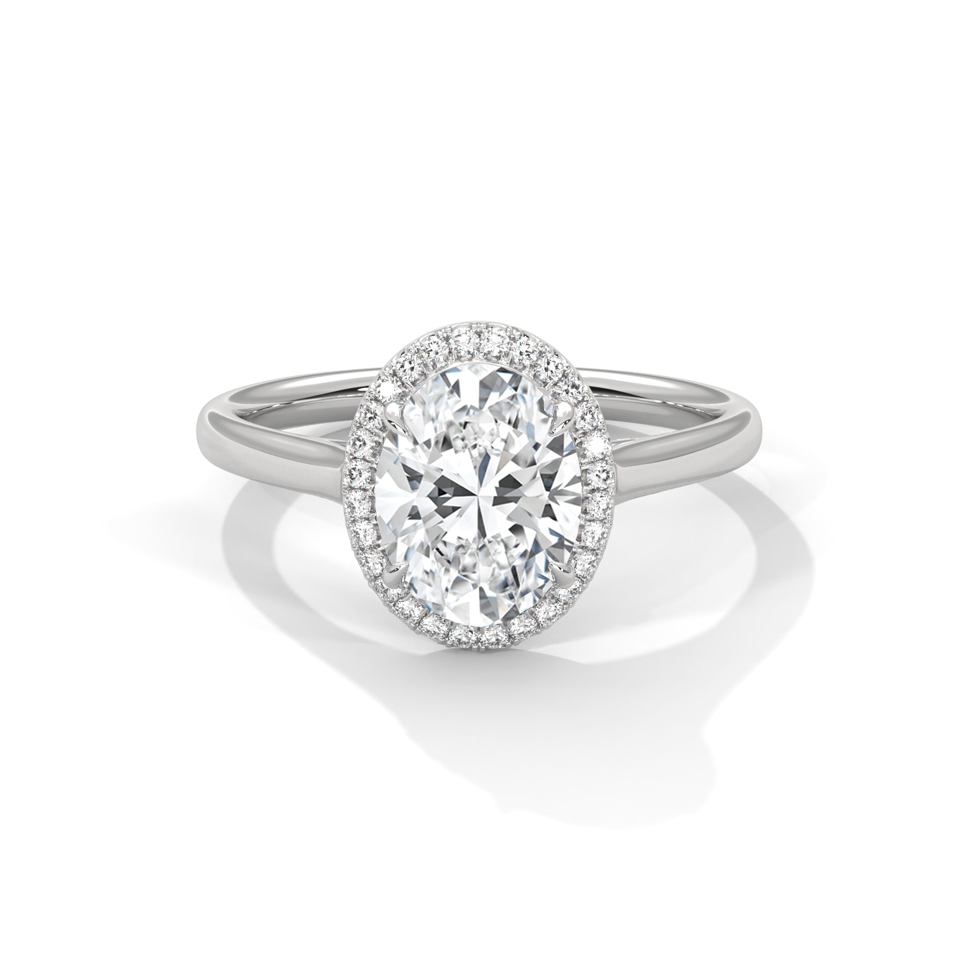 Diamond ring with a halo on a white background