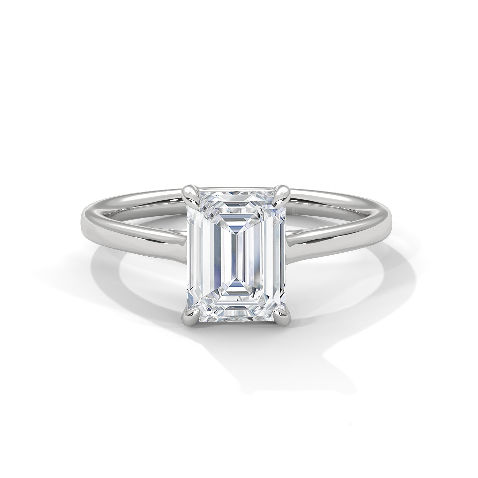 Diamond ring with emerald-cut gemstone on a white background