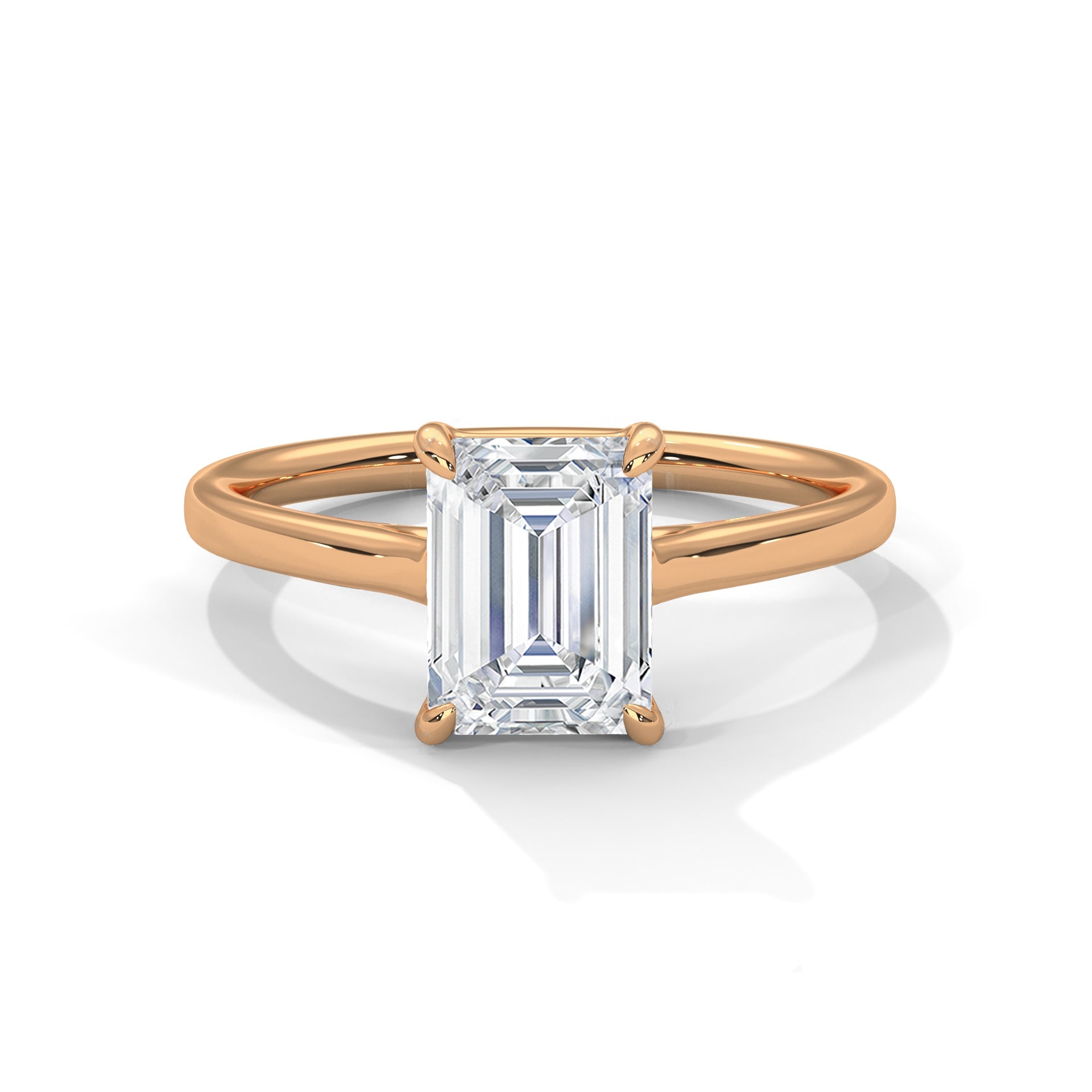 Rose gold ring with a large emerald-cut diamond on a white background
