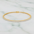 Gold bracelet with diamonds on a white background