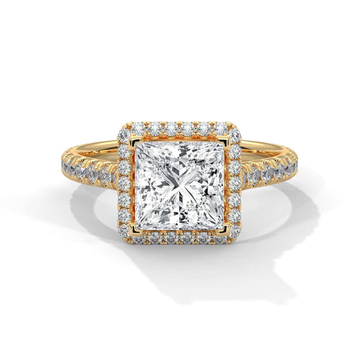 Gold ring with a large diamond and smaller diamonds on the band against a white background