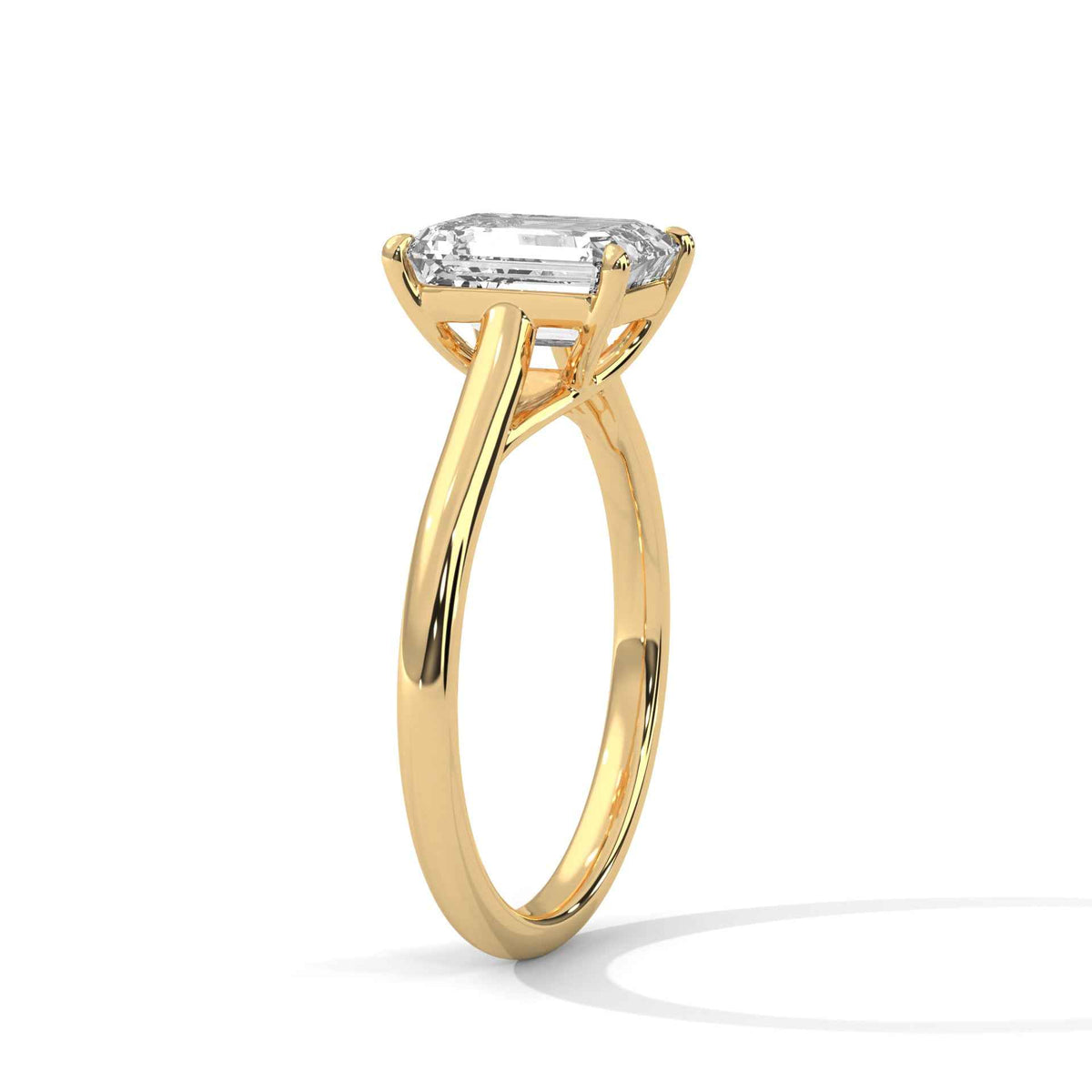 Gold ring with a diamond on a white background