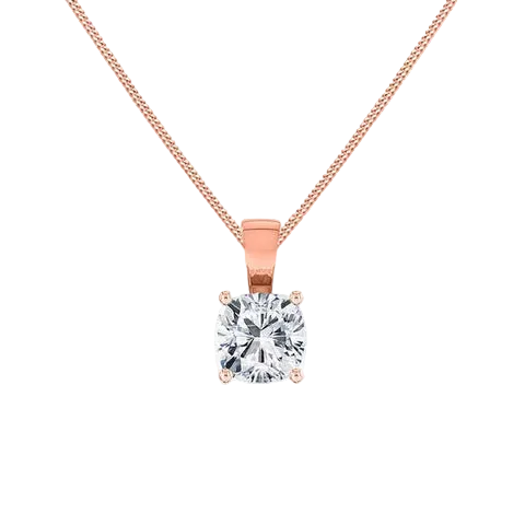 A rose gold solitaire necklace with a cushion-cut diamond pendant, shown on a clean white background with a soft reflection below.