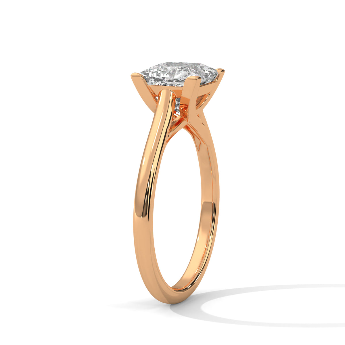 Rose gold ring with a diamond on a white background