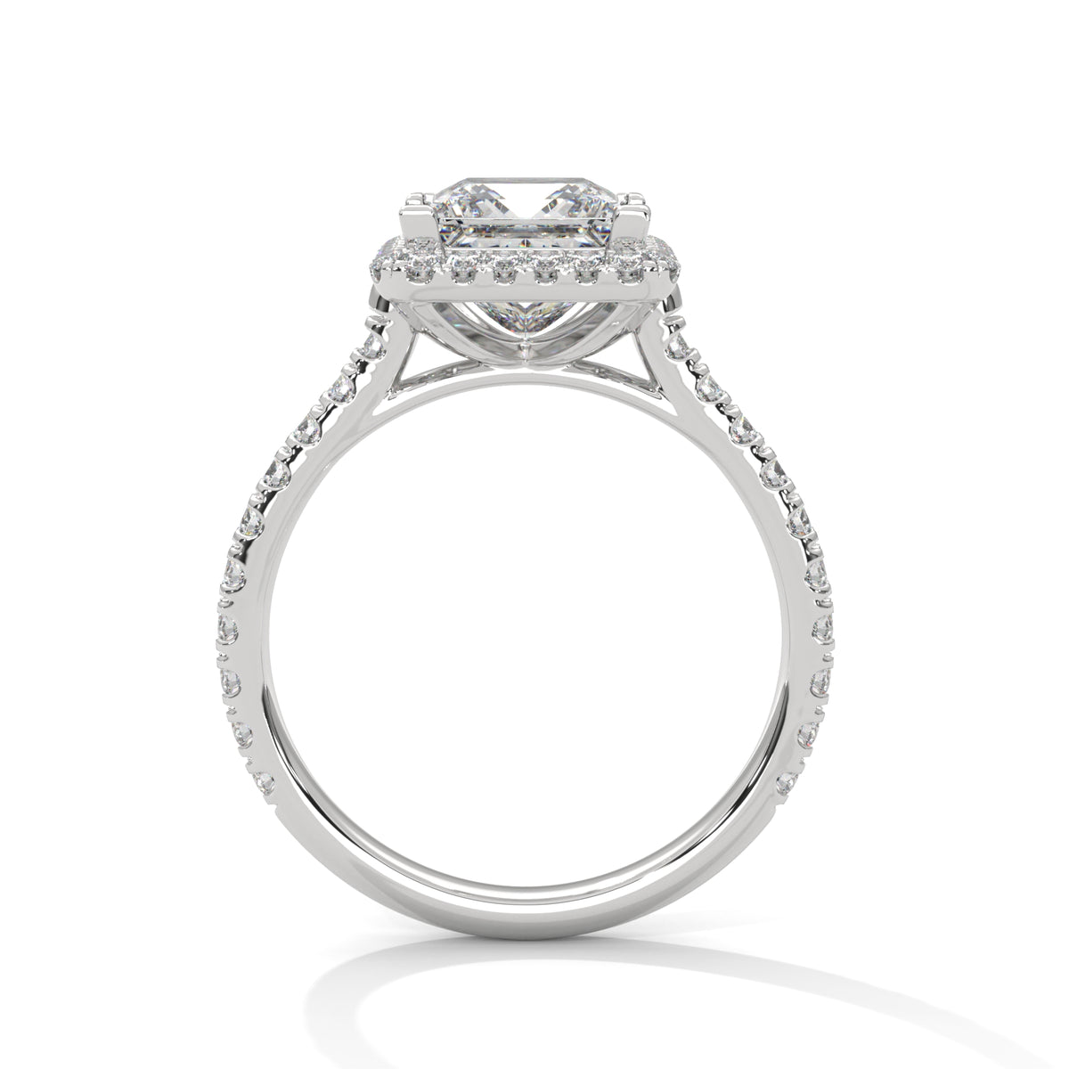 Diamond ring with a halo setting on a white background