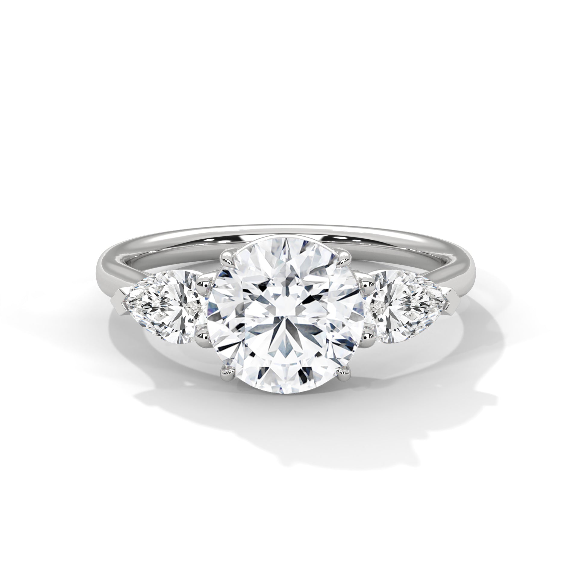 Diamond ring with three clear gemstones on a white background