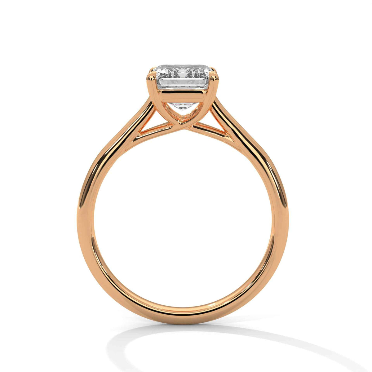 A rose gold solitaire engagement ring with a rectangular baguette-cut diamond, shown from a top-down perspective on a white background.