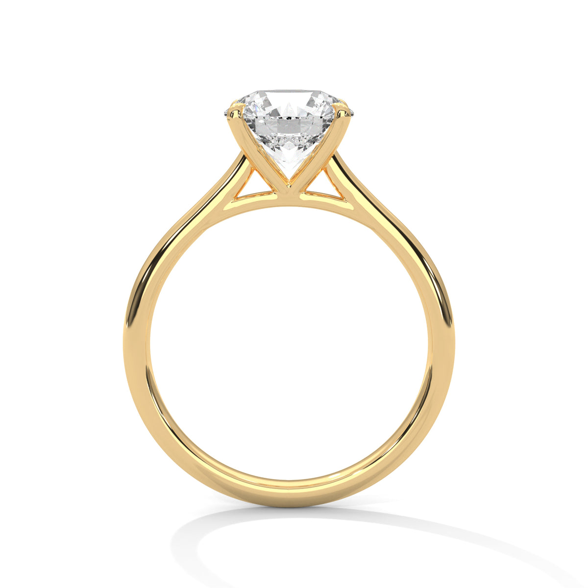 Gold ring with a clear gemstone on a white background
