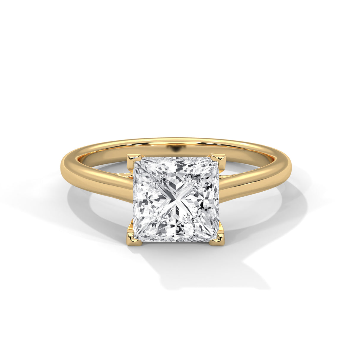 Gold ring with a square-cut diamond on a white background