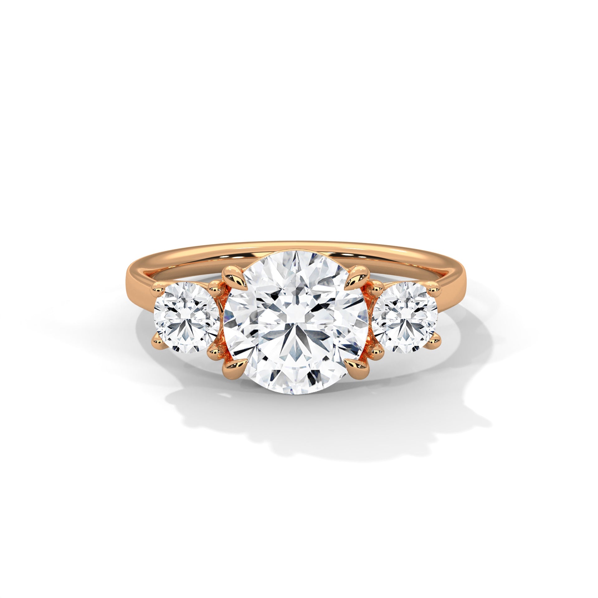 Rose gold ring with three diamonds on a white background