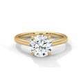 Gold ring with a large diamond on a white background