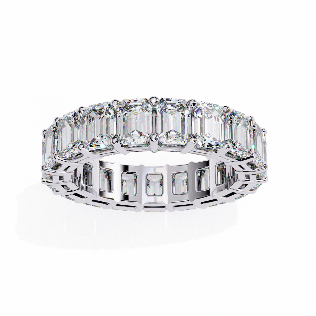 Diamond ring with emerald-cut stones on a white background