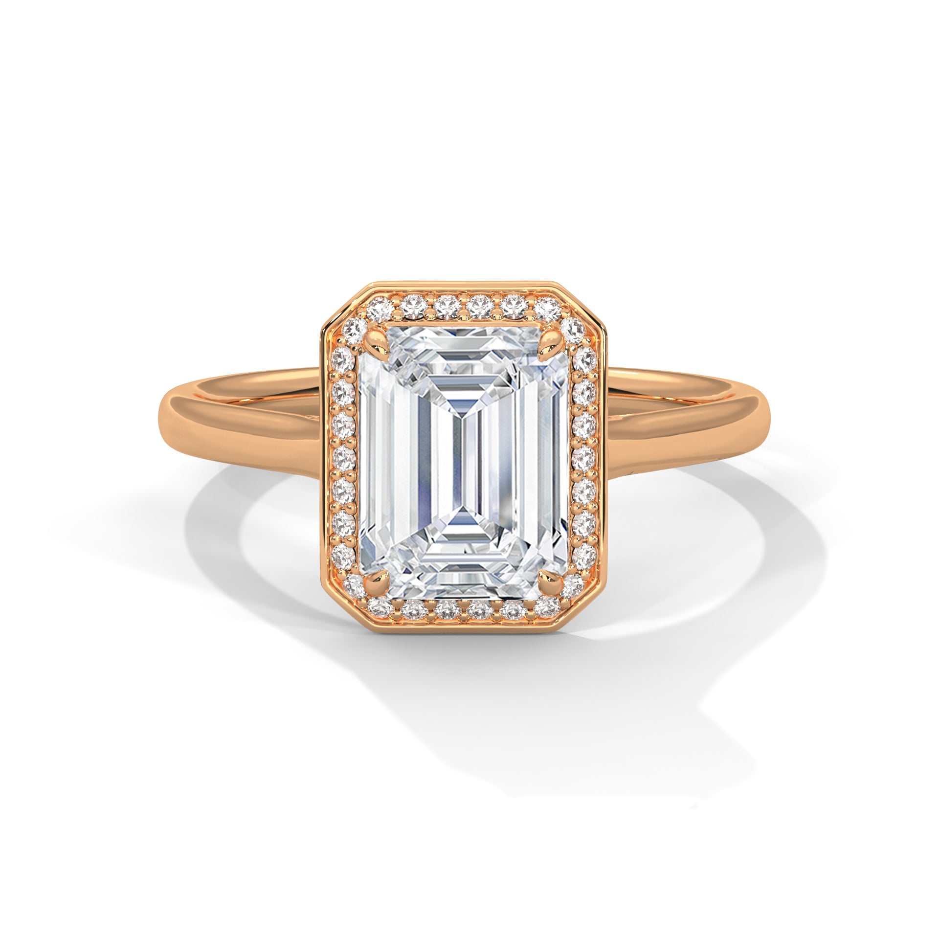 Rose gold ring with emerald-cut diamond and smaller diamonds on a white background