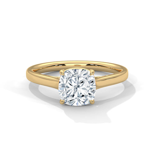 Gold ring with a large diamond on a white background