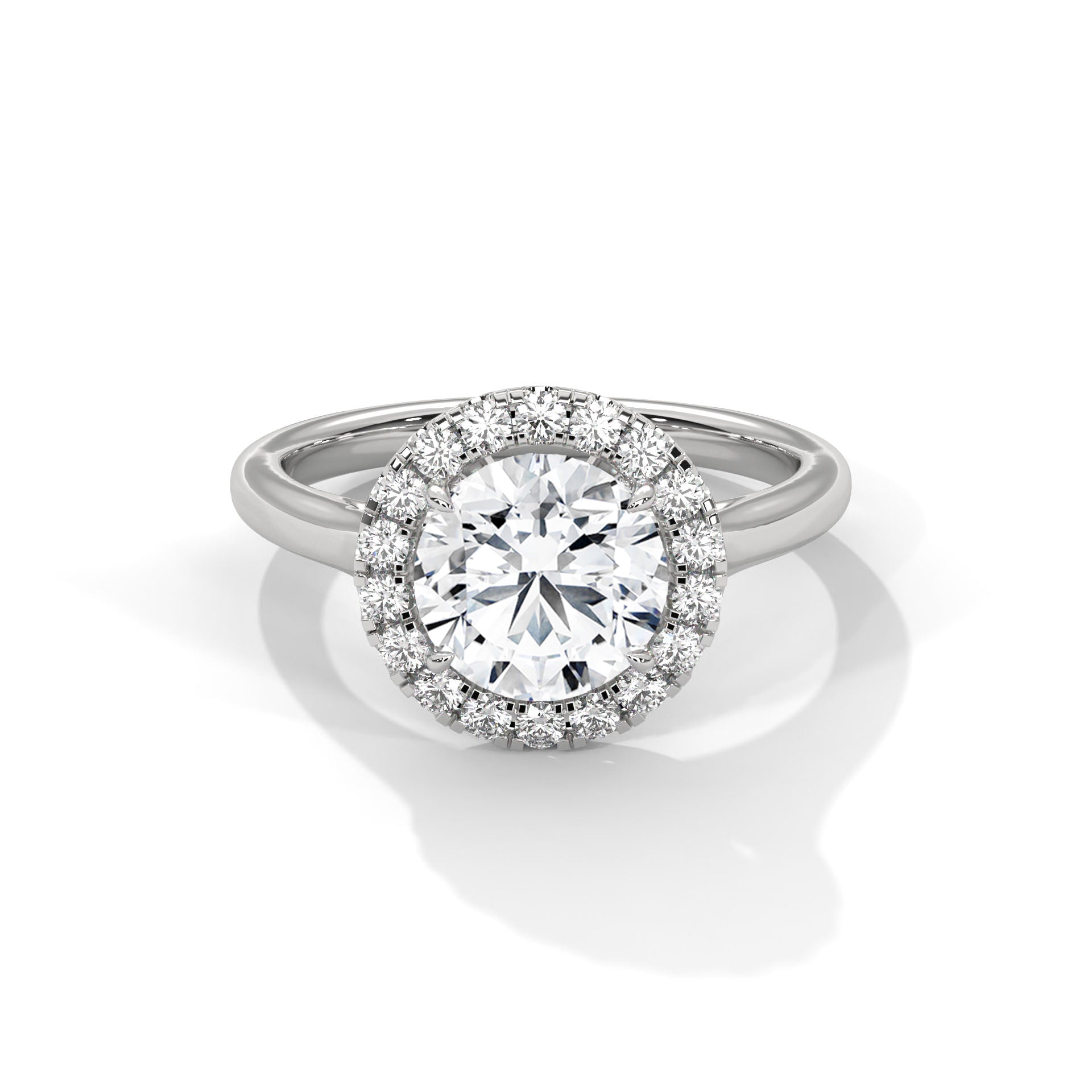 Diamond ring with a halo on a white background
