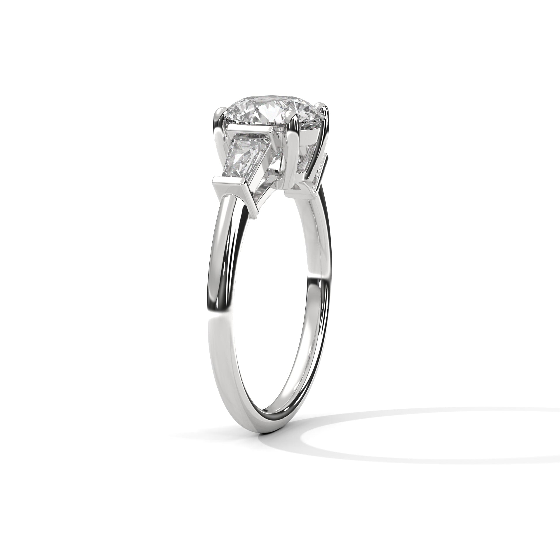 Round Three-Stone Engagement Ring with Tapered Baguettes