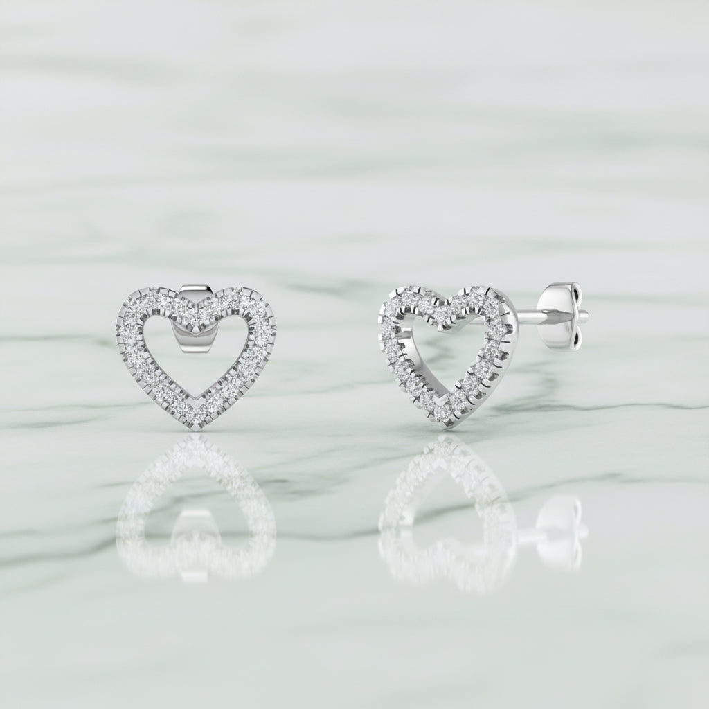 Heart-shaped earrings with small diamonds on a white background