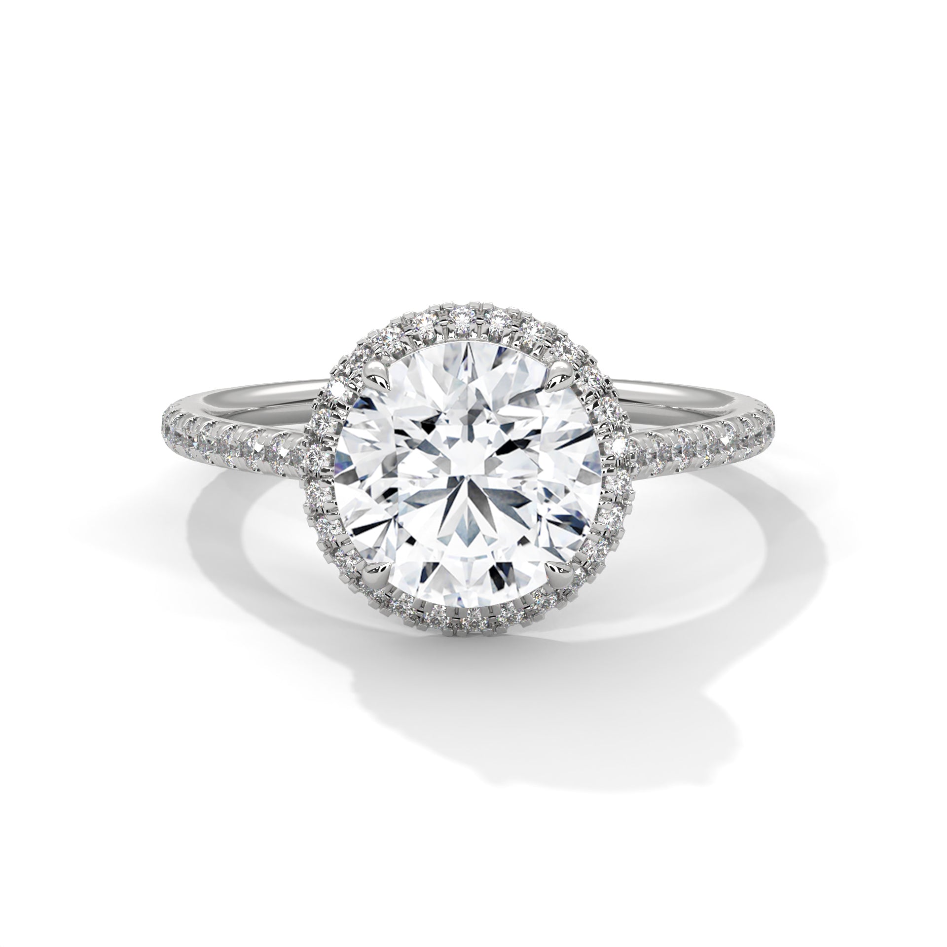 Diamond ring with a halo on a white background