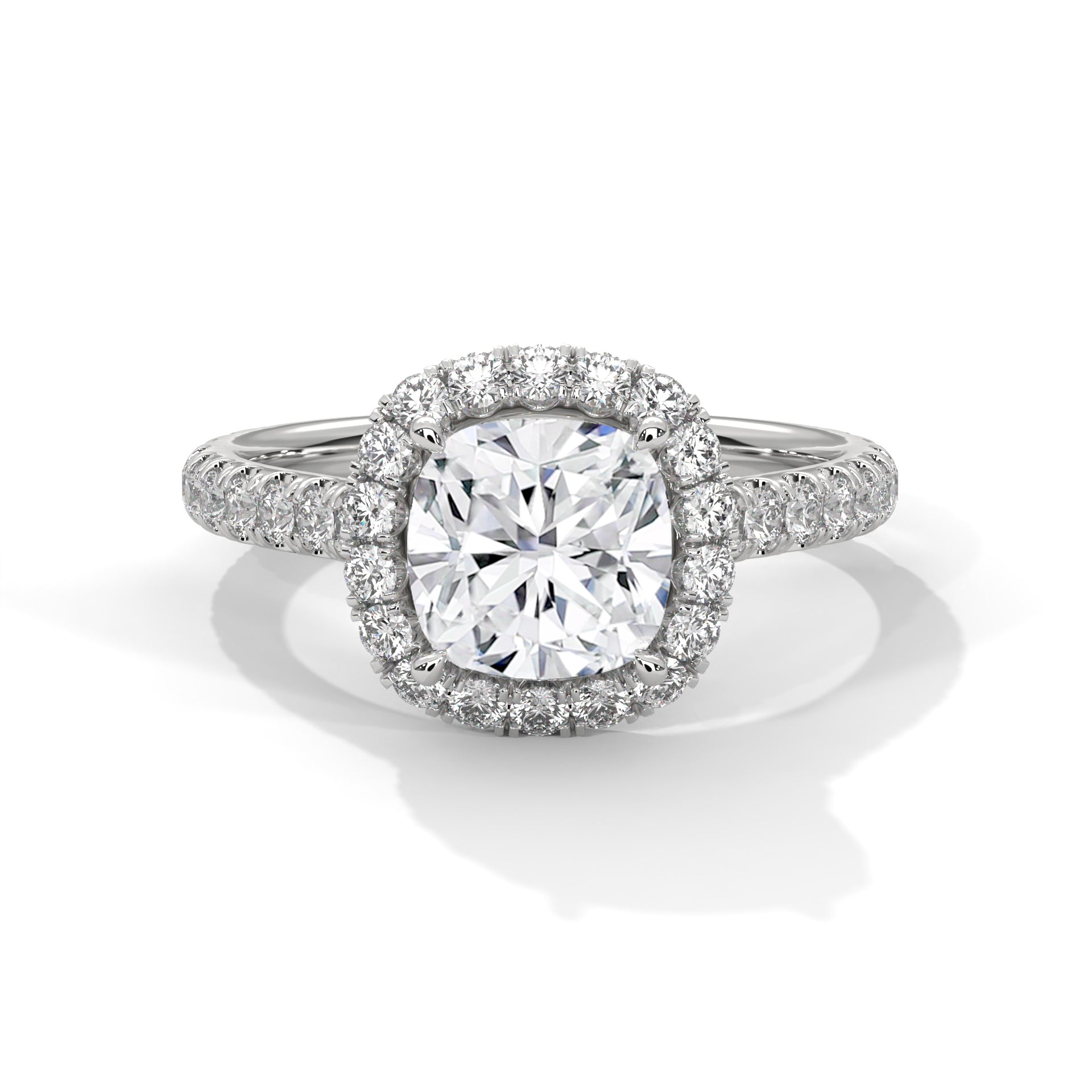 Diamond ring with a halo on a white background
