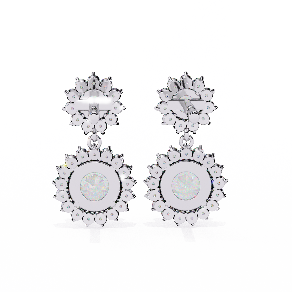 Pair of silver earrings with circular designs and clear stones on a white background