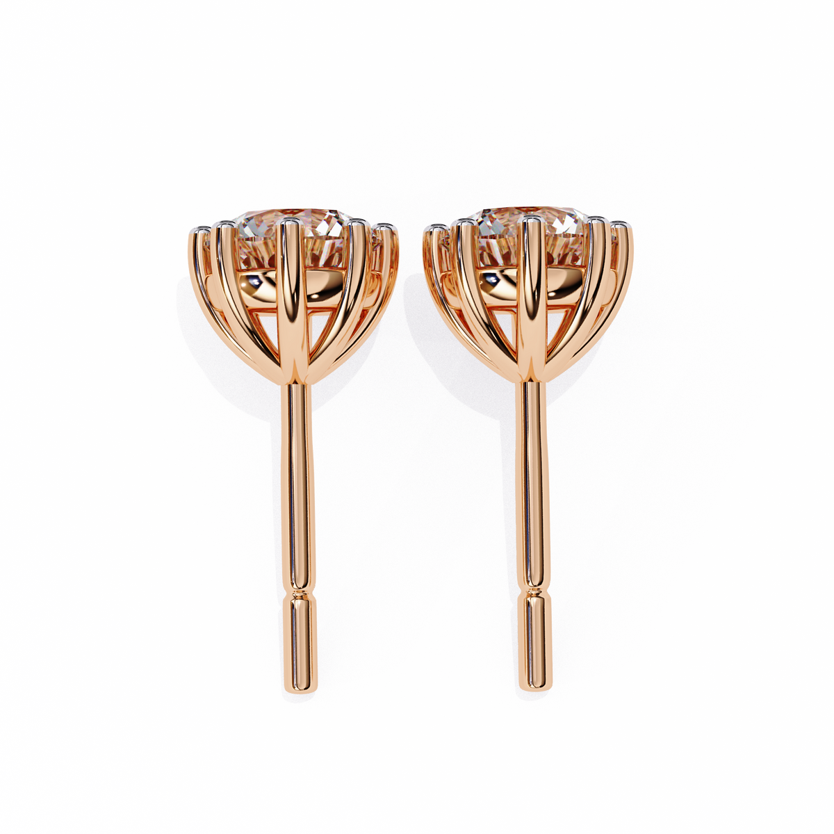 Rose gold earrings with clear gemstones on a white background