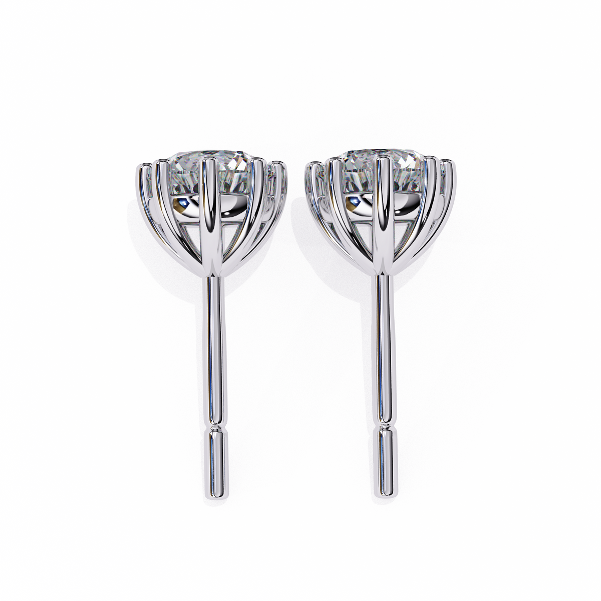 Pair of silver earrings with clear gemstones on a white background