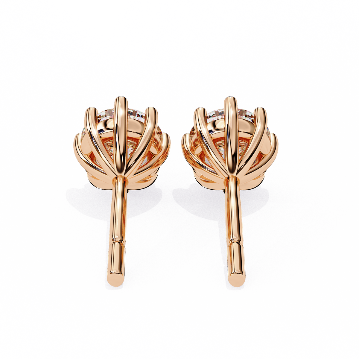 Rose gold earrings with a white background