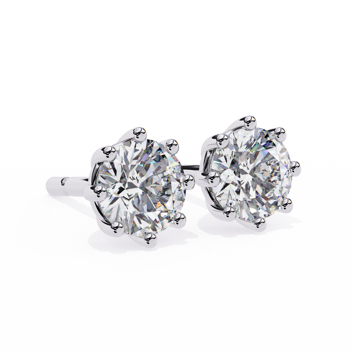 Pair of diamond stud earrings on a white background