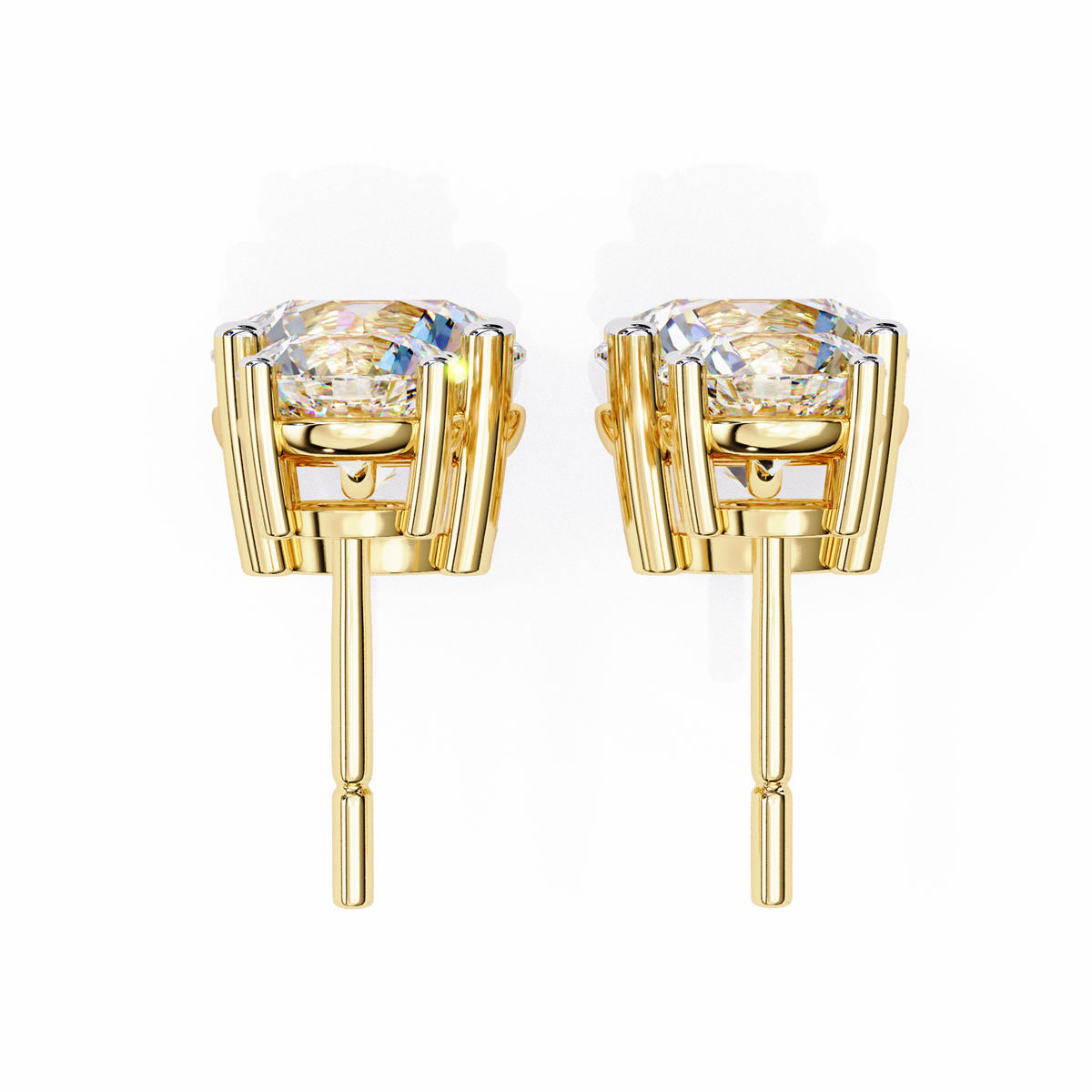 Gold earrings with clear gemstones on a white background